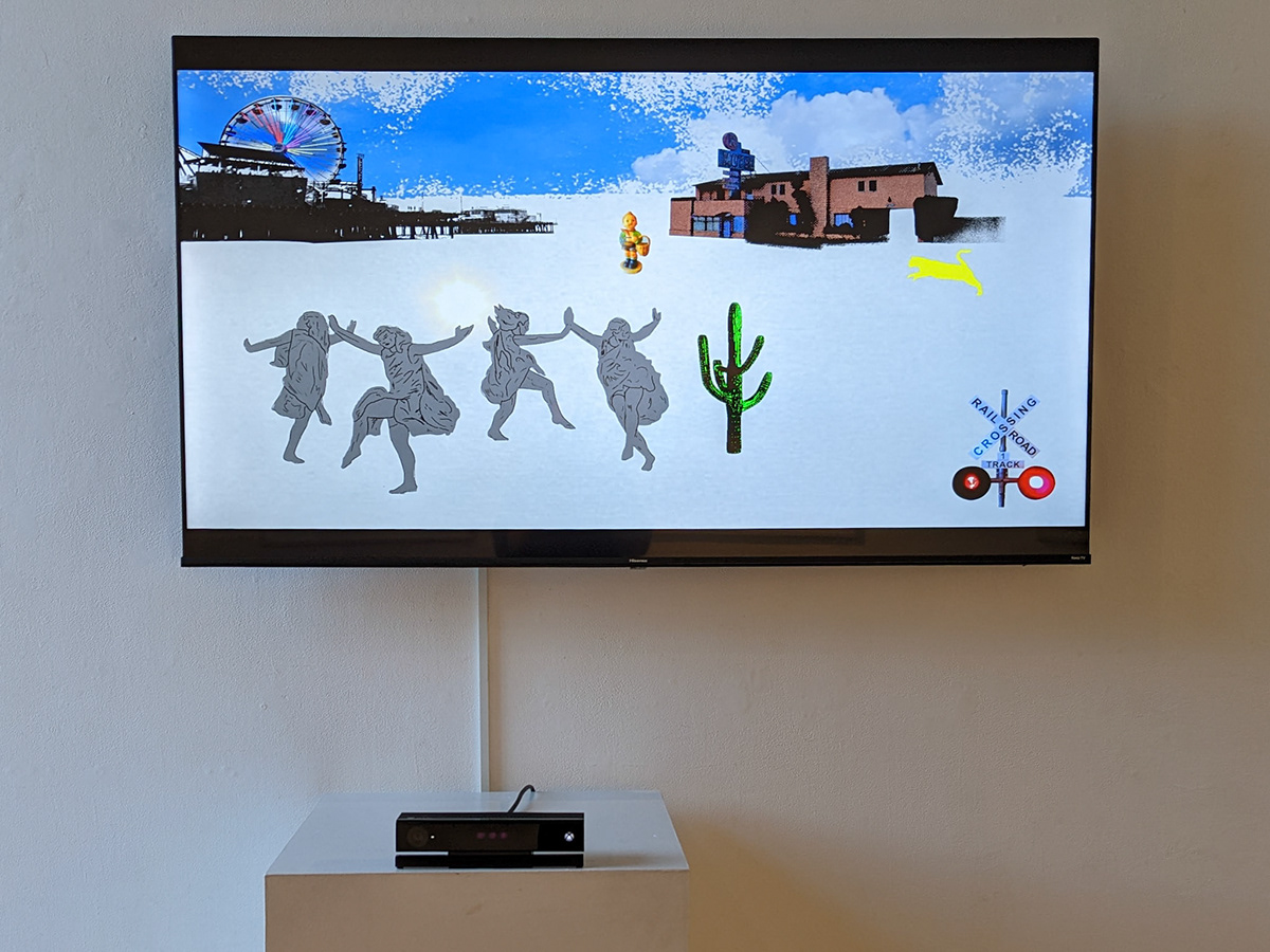 Gallery installation: a wall-mounted display showing an animated landscape with the Santa Monica pier, a ferris wheel and cactus, with four figures in the foreground. A depth sensor sits on a white plinth below the screen, cabled up the wall.